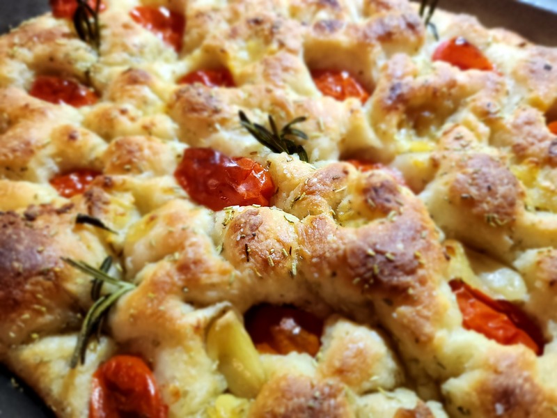 Focaccia Rosmary Tomatoe Garlic
Style of pizza with organic tomatoes
 rosemary garlic and olive oil. May be
 served as a side dish or as sandwich
 bread. Perfectly soft, fluffy and
 satisfying. 
13x9 