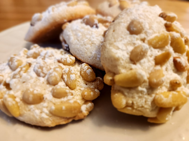 Pignolis
Our traditional Sicilian pine-nut
 studded cookie, pleasantly sweet, soft
 and chewy with a crispy exterior .